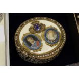 A decorative gilt metal and enamel box with portrait miniature cover (lacking inset stones).