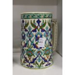 An Iznik style large pottery tankard.