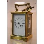 A brass carriage clock.