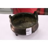 A Chinese bronze twin handled circular censer.