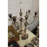 A pair of plated candelabra.