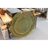 A large engraved brass eastern circular tray / table top.
