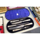 A cased silver handled carving set.