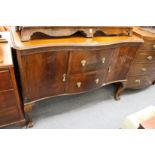 A mahogany serpentine fronted sideboard.