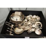 A large quantity of silver items to include spoons, sugar nips, toast rack etc.