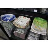 A blue and white dish, decorative serving dishes and a pair of asparagus dishes.