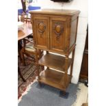 A French walnut two door music cabinet.