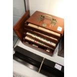 A mahogany cased Mahjong set with hardwood stands.
