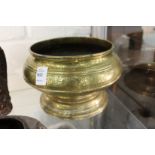 A good eastern engraved brass circular pedestal bowl.
