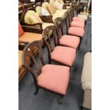 A set of six Victorian mahogany dining chairs.