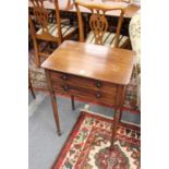 A good early 19th century mahogany two drawer side table with ebony inlaid decoration on turned