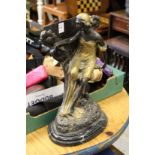 A cast bronze figural stand.