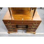 A Georgian style mahogany kneehole desk.