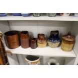 Doulton jugs, a salt glazed jar and cover and a wooden grain measure.