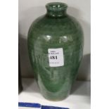 A Chinese green ground pottery vase.