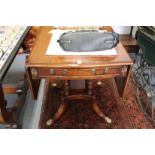 A mahogany drop leaf single pedestal table.