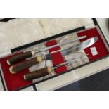 An antler handled carving set, cased.