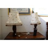 A pair of decorative table lamps, the bases carved as African busts.