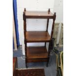 A 19th century rosewood three tier what-not with a drawer to the base.