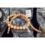A stained ivory bead necklace.