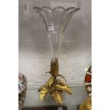 A cut glass trumpet shaped vase with ormolu base.