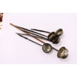 A collection of six silver and white metal toddy ladles.