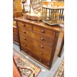 A 19th century mahogany chest of drawers with column supports.