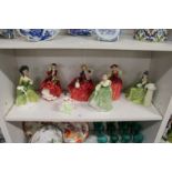A collection of Royal Doulton figurines.
