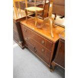 A mahogany bedroom chest.