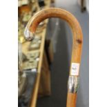 A silver mounted walking stick.