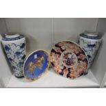 A large Imari dish, a Satsuma dish and a pair of modern Chinese blue and white vases.