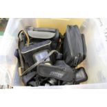 A quantity of old cameras and camera equipment.