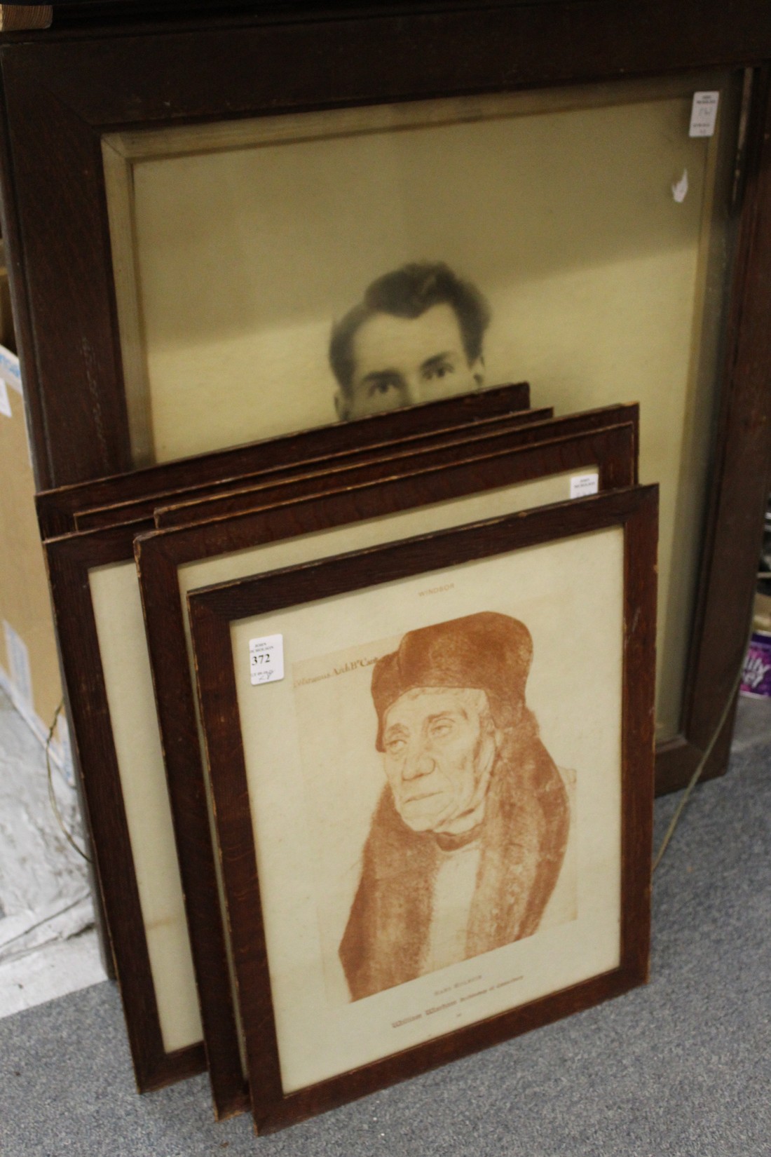 A quantity of oak framed prints.