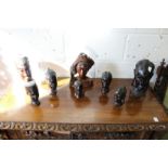 A collection of African and Polynesian carved hardwood busts.