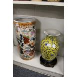 A Chinese stick stand and a large Chinese yellow ground porcelain vase and stand.