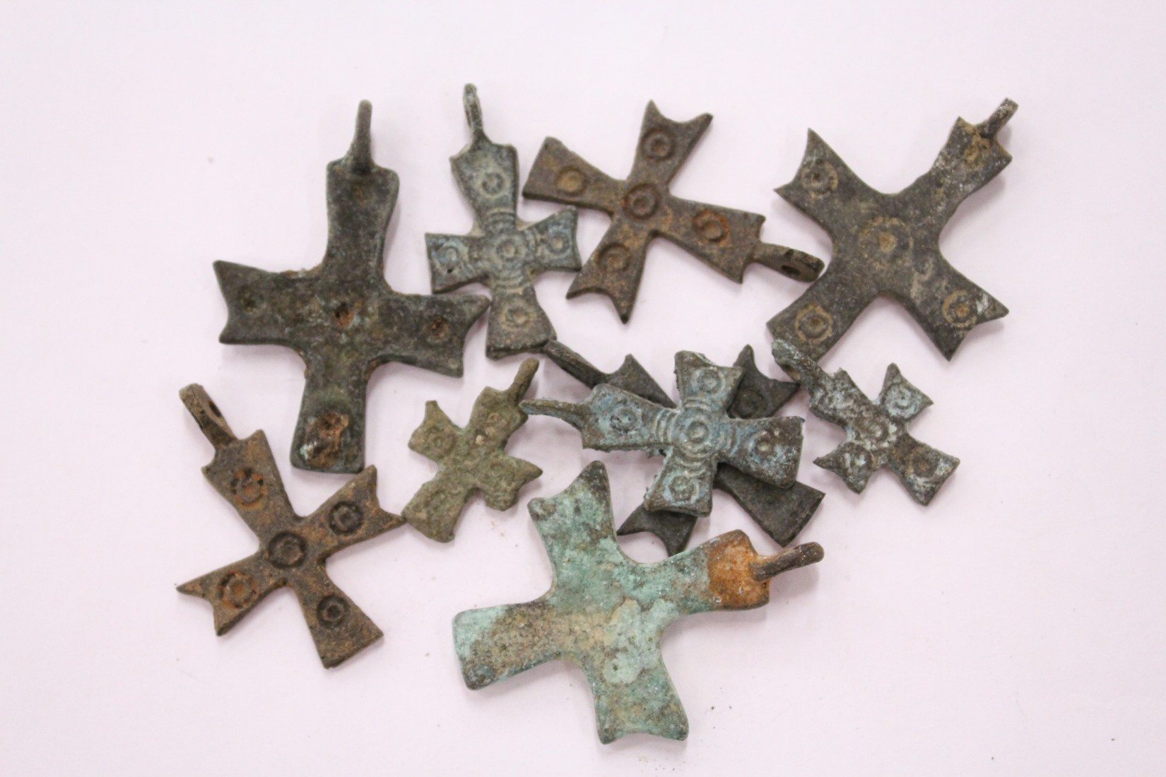 A group of small bronze crosses.