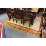 A Persian design cream ground carpet with colourful border.