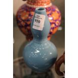 A small Chinese pale blue gourd shaped vase.