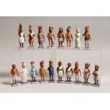 A BOX OF CARVED AND PAINTED INDIAN WOODEN FIGURES, mostly, 3.75ins high.