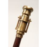 A NOVELTY WALKING STICK, the handle as a telescope and compass. 39ins high.