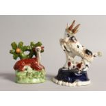 A SMALL STAFFORDSHIRE BOCAGE GROUP OF A DEER with spots and a GOAT with KID. 3.5ins & 5ins high. (