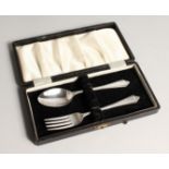 A CASED SILVER CHRISTENING SET,comprising of a spoon and fork. Sheffield 1964.