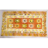 A PERSIAN KELIM CAPET, orange ground with typical geometric decoration 7ft 9ins x 4ft 5ins