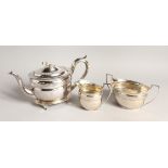 A GOOD SCOTTISH SILVER FOUR PIECE TEA SERVICE, comprising an oval tea pot with cast thistle