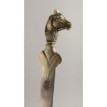 A SUPERB RUSSIAN SLIVER LETTER OPENER with initials and horse's head with sapphire eyes. Faberge