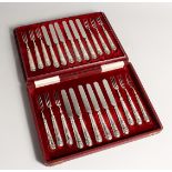 A CASED SET OF TWELVE SILVER HANDLED FRUIT KNIVES AND FORKS. Sheffield 1926.