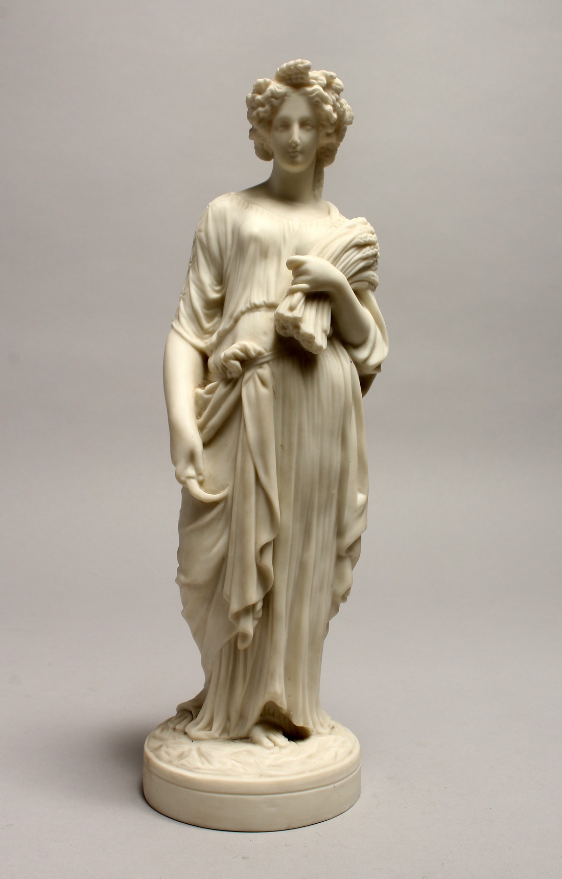 A 19TH CENTURY PARIAN FIGURE DEPICTING HARVEST 23ins high