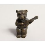 A NOVELTY BRASS BEAR PLAYING A GUITAR VESTA