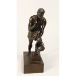 A GRAND TOUR BRONZE OF A MAN CARRYING A HELMET on a rectangular base 9ins high