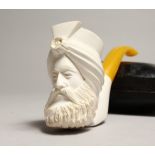 A 19TH CENTURY MEERSCHAUM PIPE as the head of a Turkish man, in a leather case.